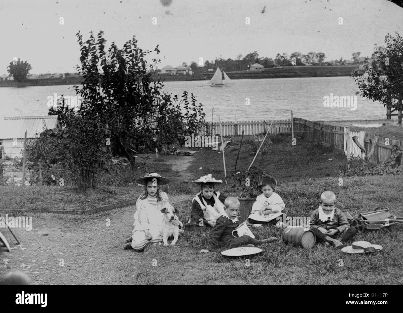 1 55004 Children from the Brown family in the backyard of their home at