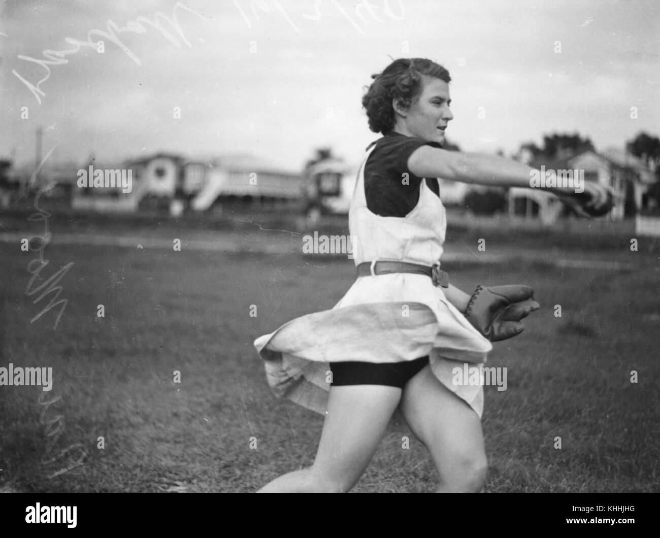 2 105488 Female baseball player in action on the field, Brisbane, 1940