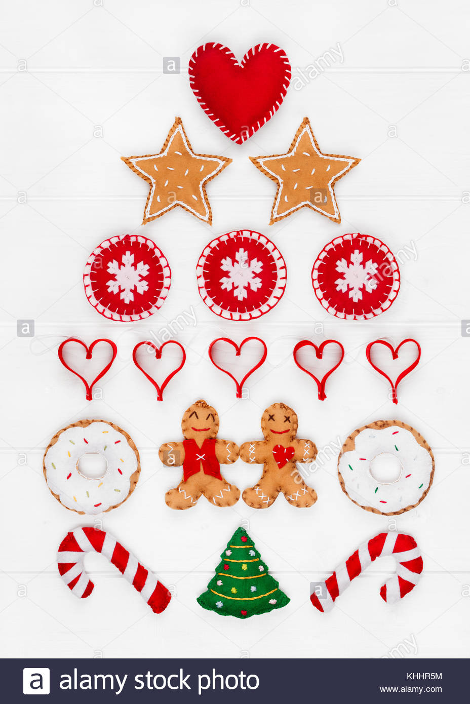 overhead view of various handmade felt christmas decorations on a white wooden background - Handmade Felt Christmas Decorations overhead view of various handmade felt christmas decorations on a white wooden background - Handmade Felt Christmas Decorations