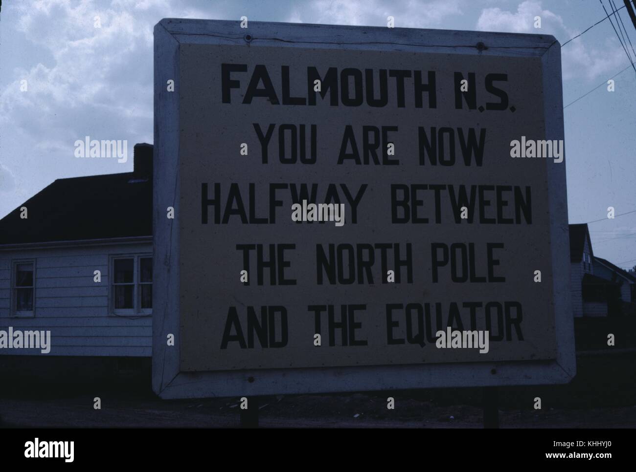 A Photograph Of A Sign In Falmouth Stating That It Is Placed Halfway a-photograph-of-a-sign-in-falmouth-stating-that-it-is-placed-halfway
