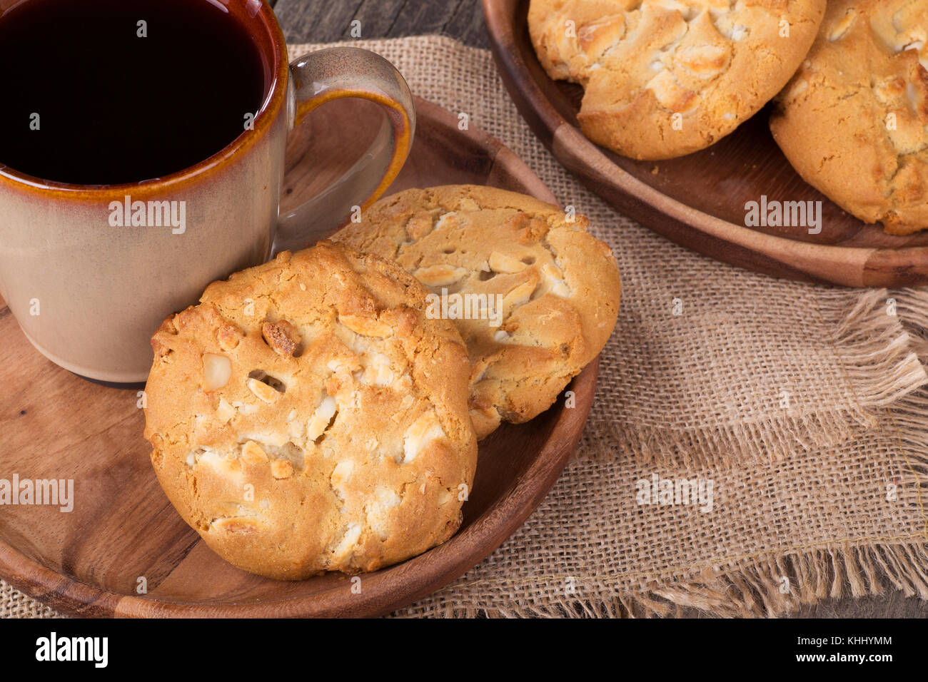 White chocolate macadamia nut cookies and cup of coffee Stock Photo