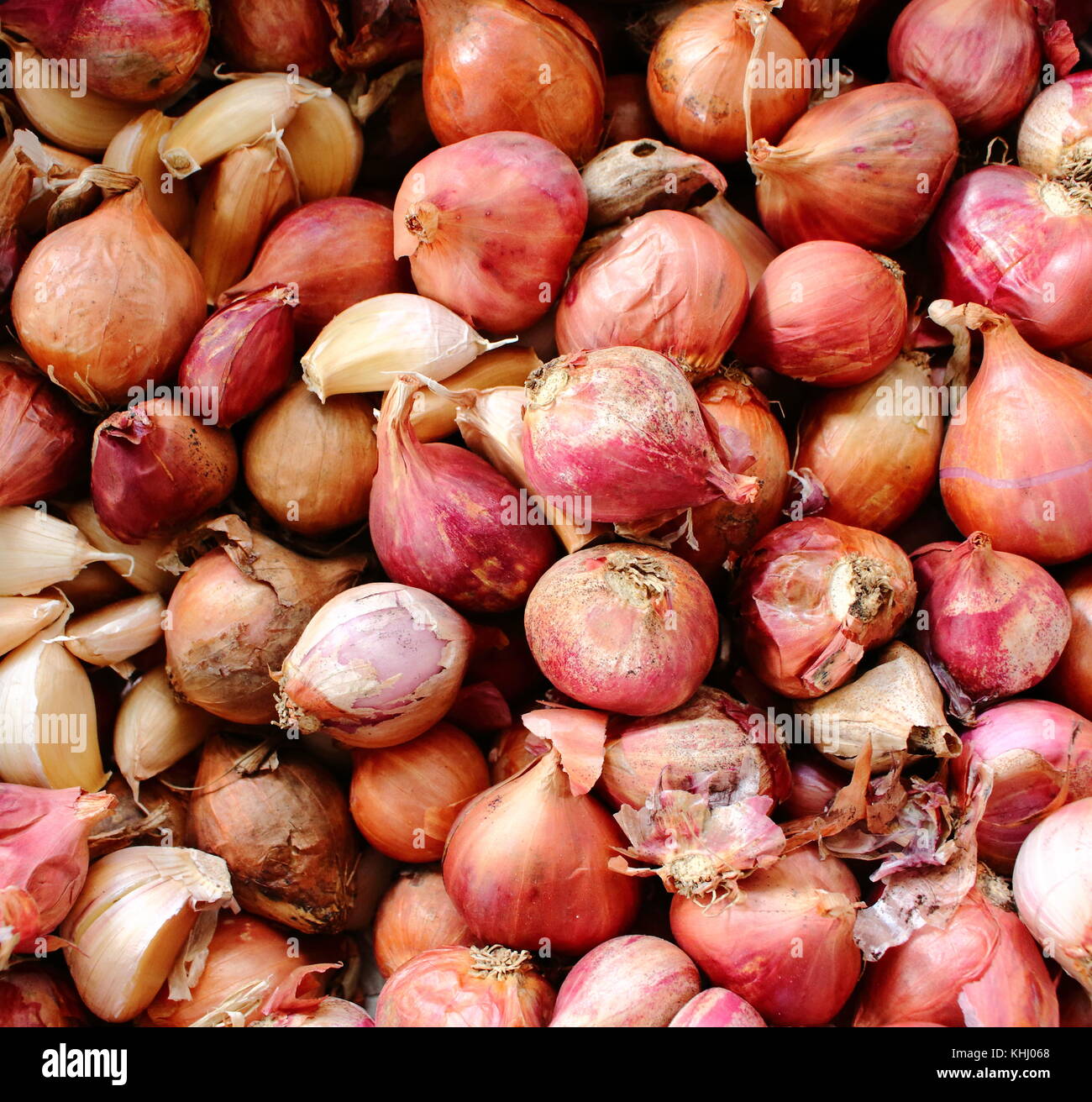 Abstract background of red shallots in the basket. Shallots is Thai herb. Top view of red shallots. Stock Photo