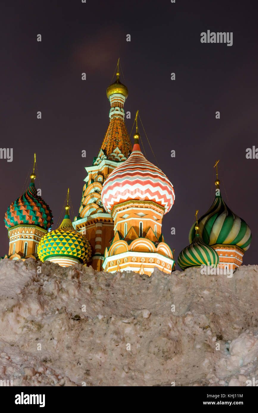 a high snow drift and a view of the St. Basil's Cathedral on Red Square ...