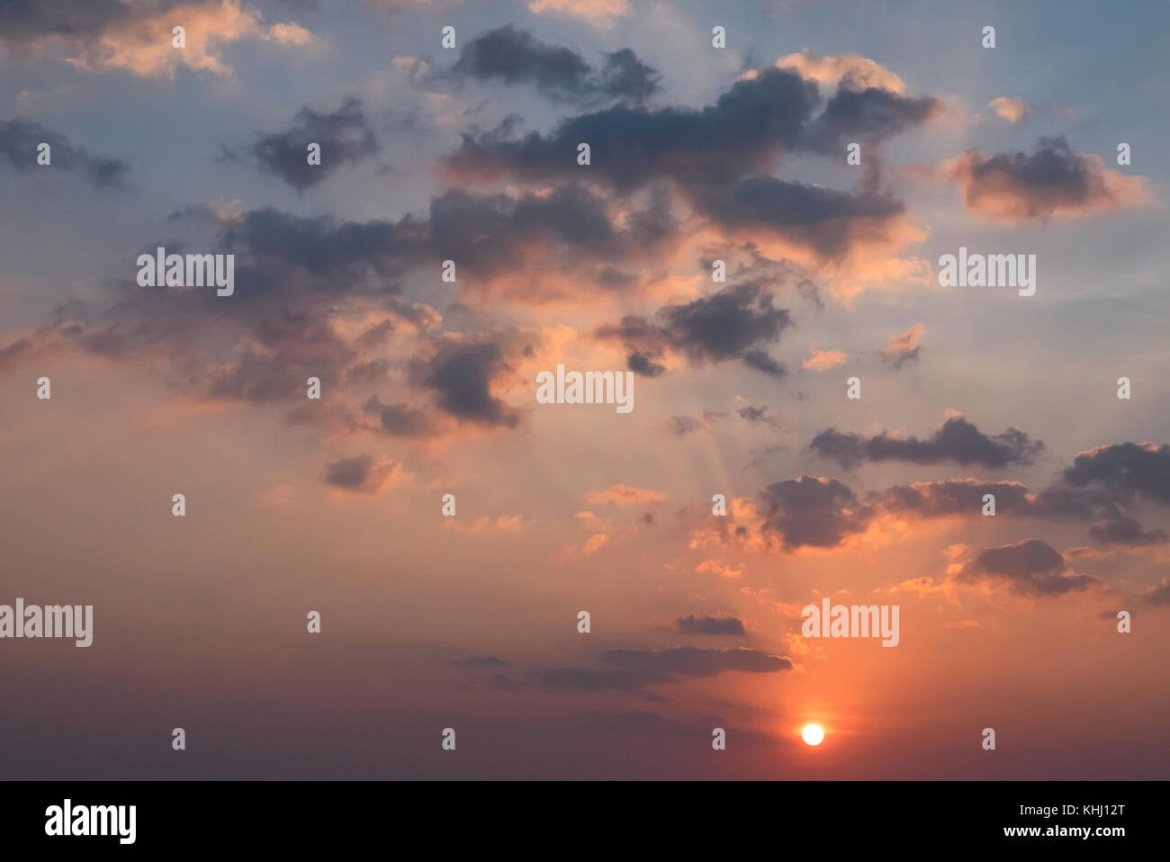 Sunset with clouds, light rays and other atmospheric effect Stock Photo ...