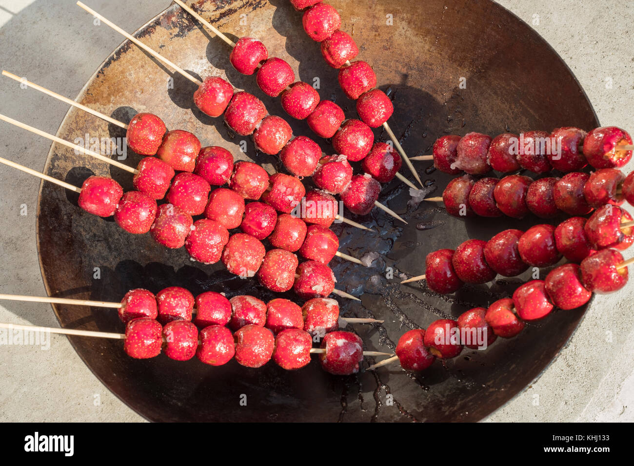 Bingtanghulu, sugarcoated haws on a stick. Beijing, China Stock Photo
