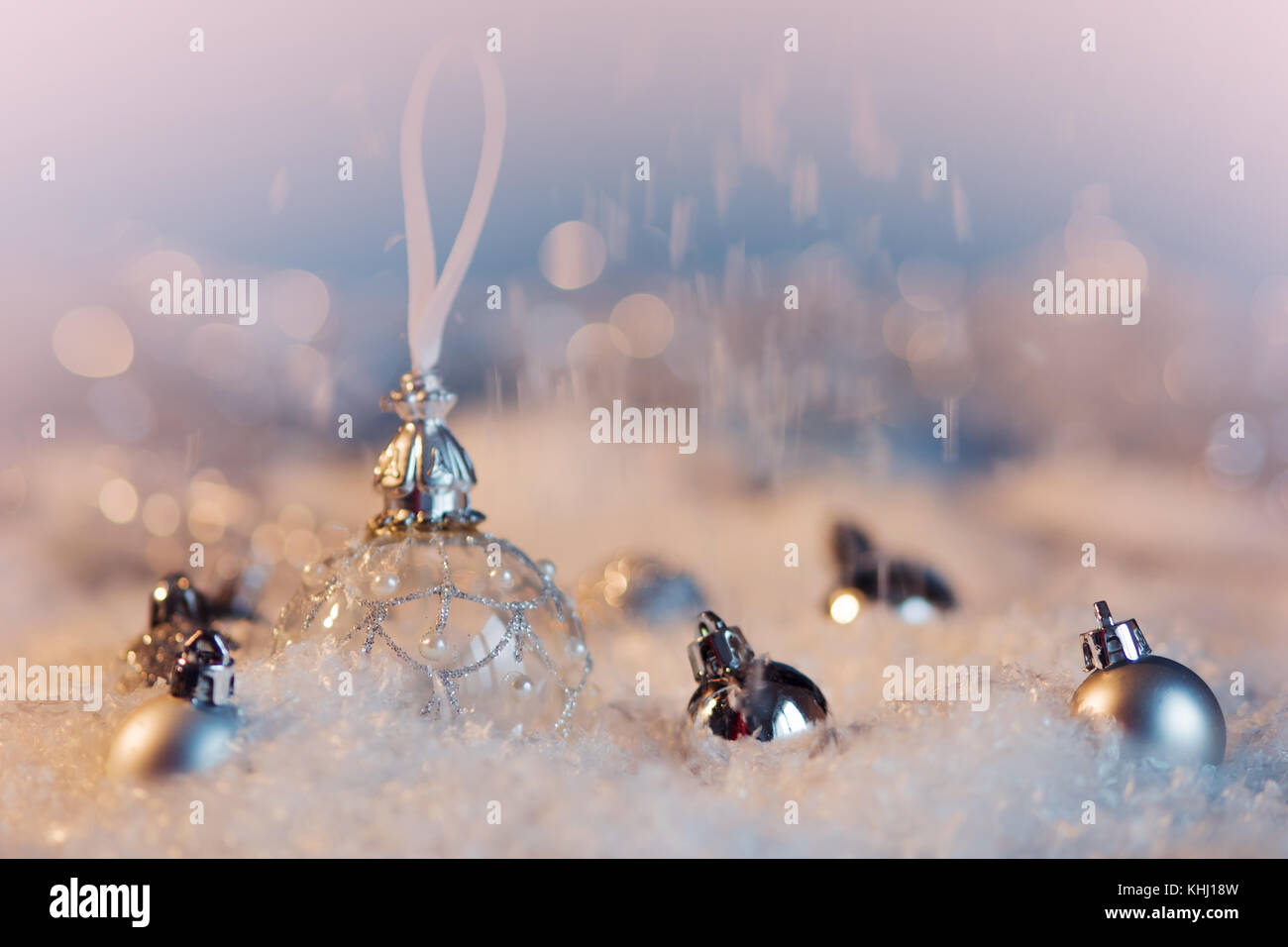 Christmas ball on the snow festive background Stock Photo - Alamy