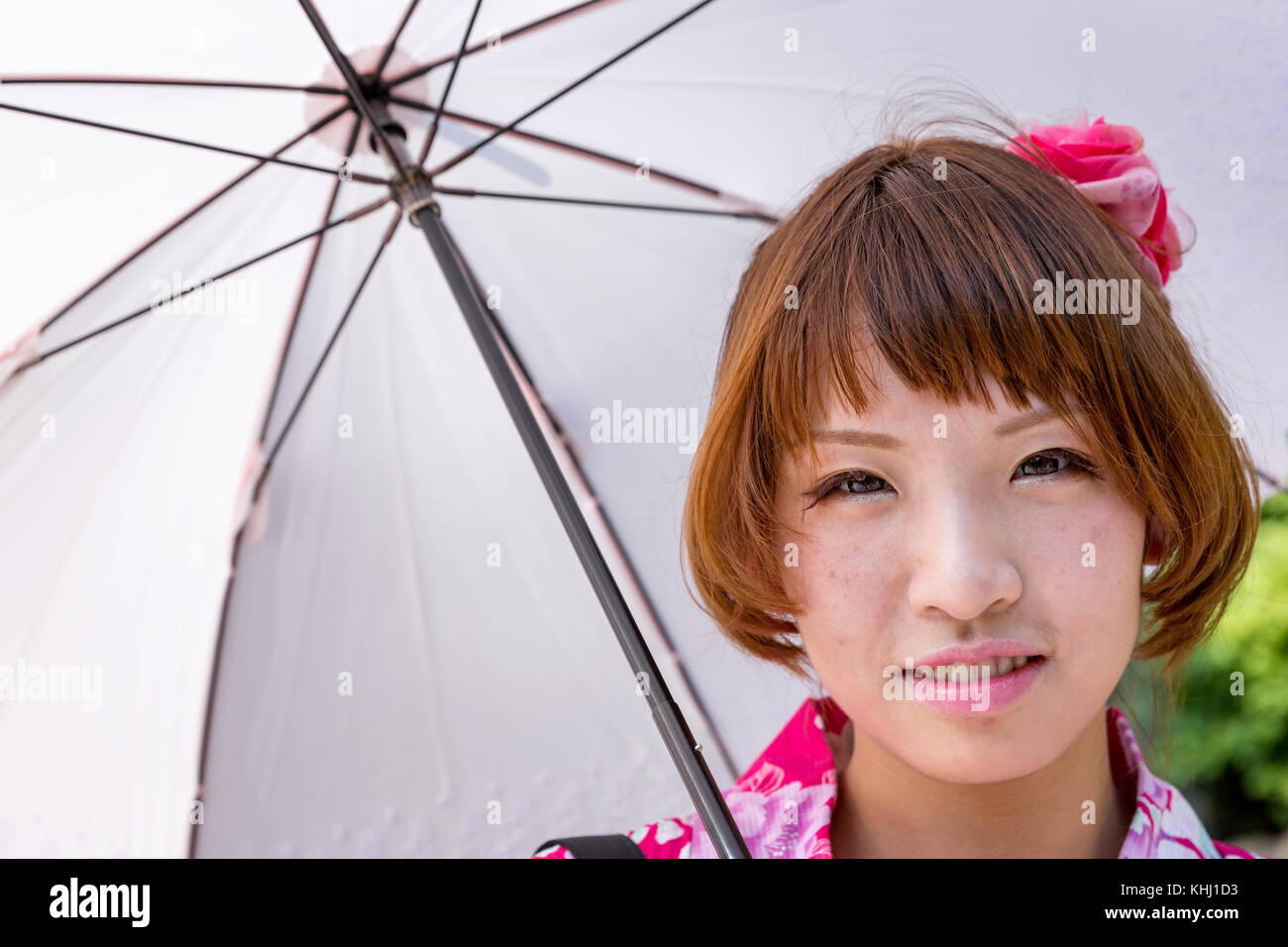 Portrait of a smiling Japanese woman, Tokyo, Japan Stock Photo