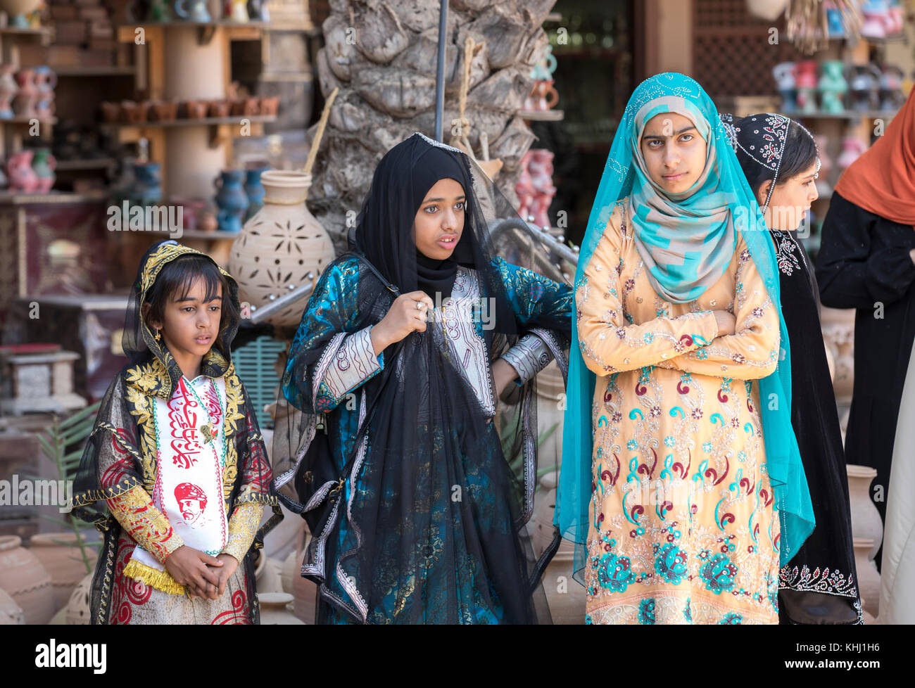 Nizwa, Oman, November 10th, 2017: omani girl dressed in traditional cloting singing Stock Photo