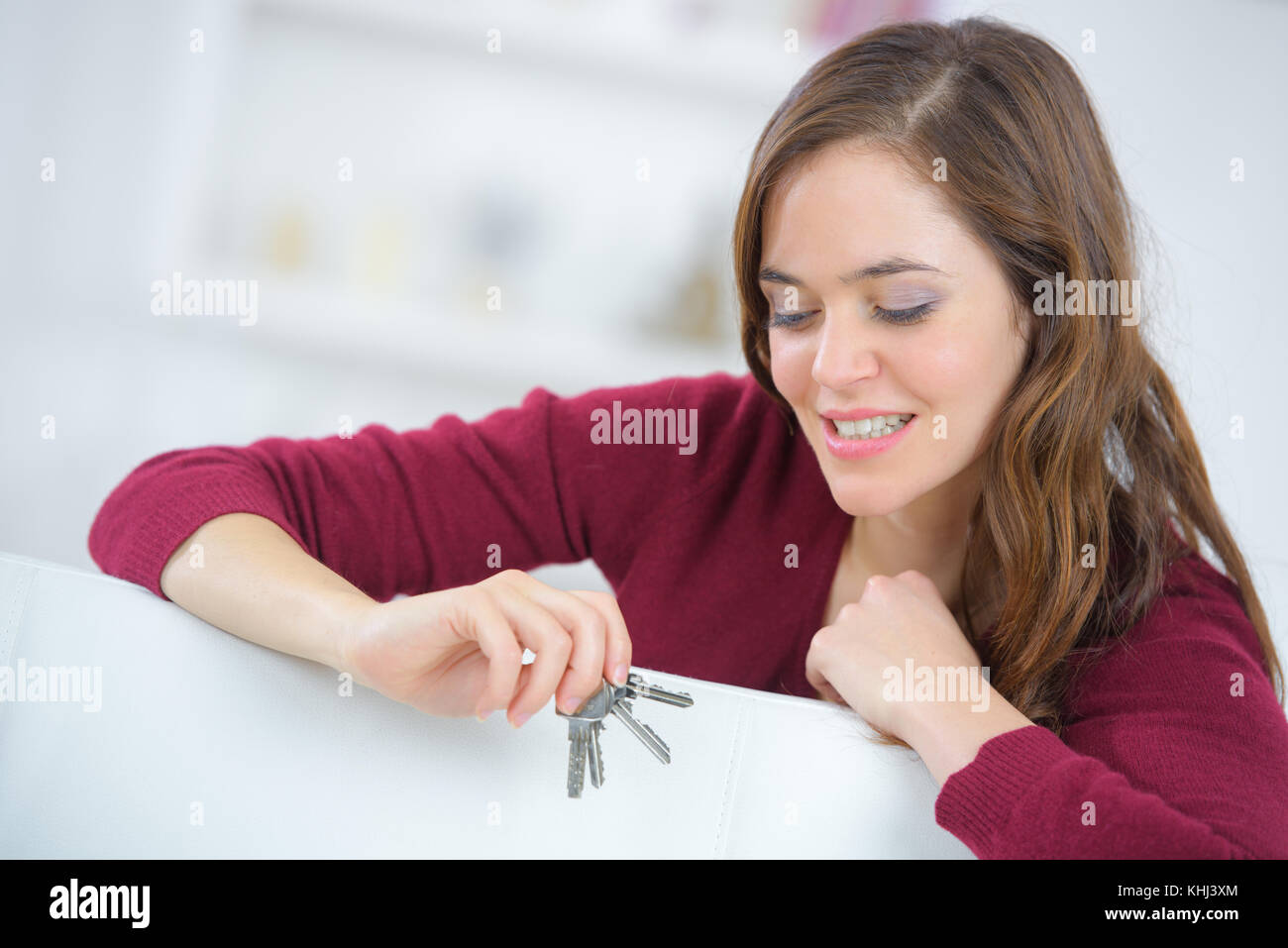 happy woman holding the key of new home Stock Photo - Alamy
