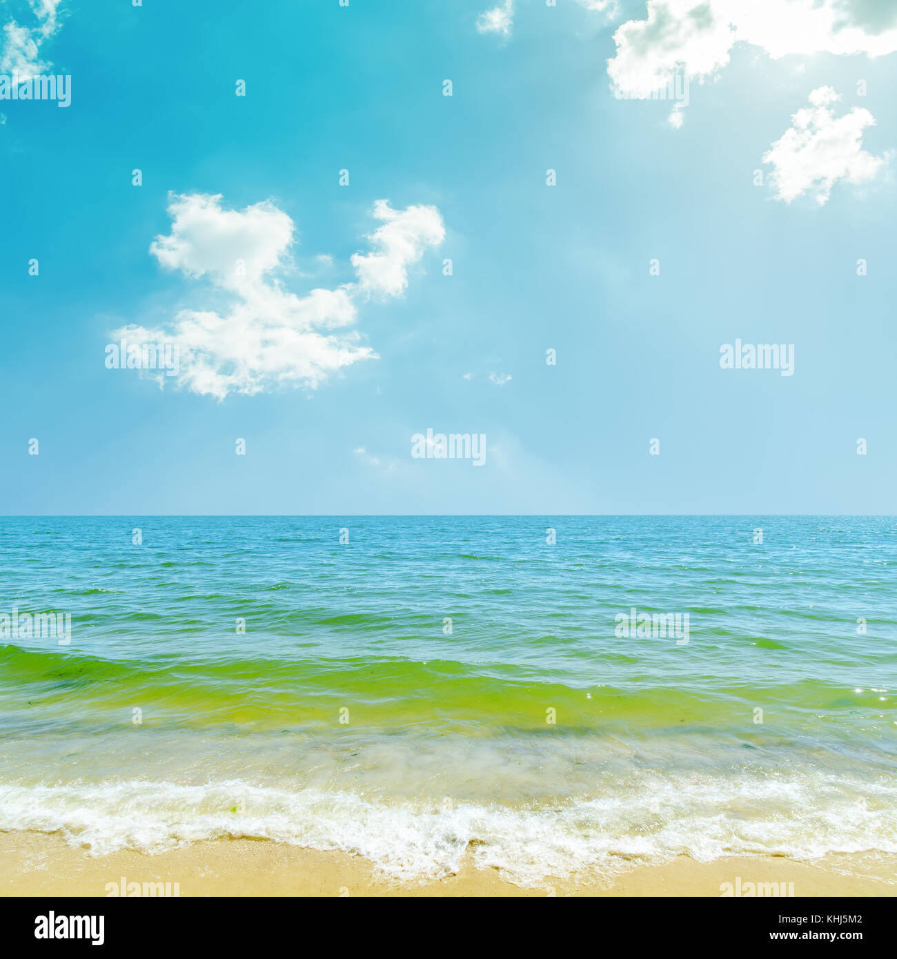 blue sky with clouds and sun over sea Stock Photo - Alamy