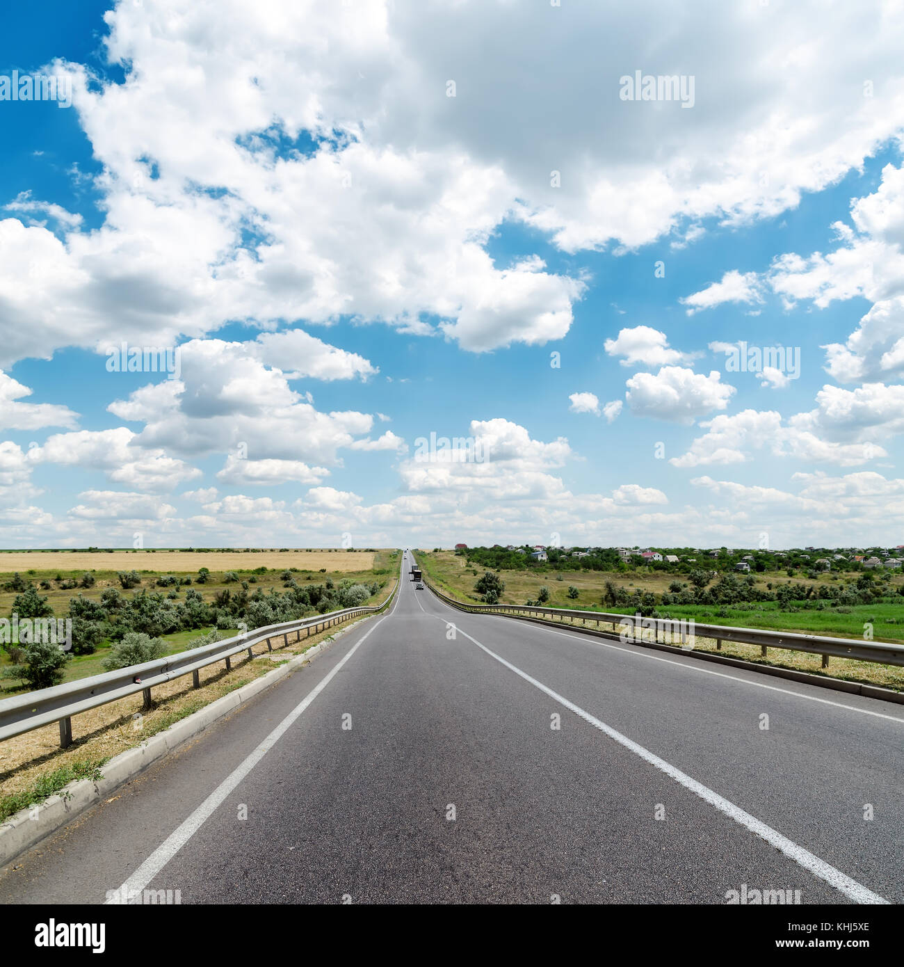 asphalt road goes to cloudy horizon Stock Photo - Alamy