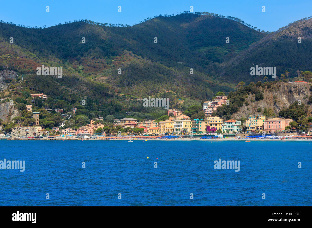 Summer Monterosso view from excursion ship. One of five famous villages of Cinque Terre National Park in Liguria, Italy, suspended between sea and lan Stock Photo