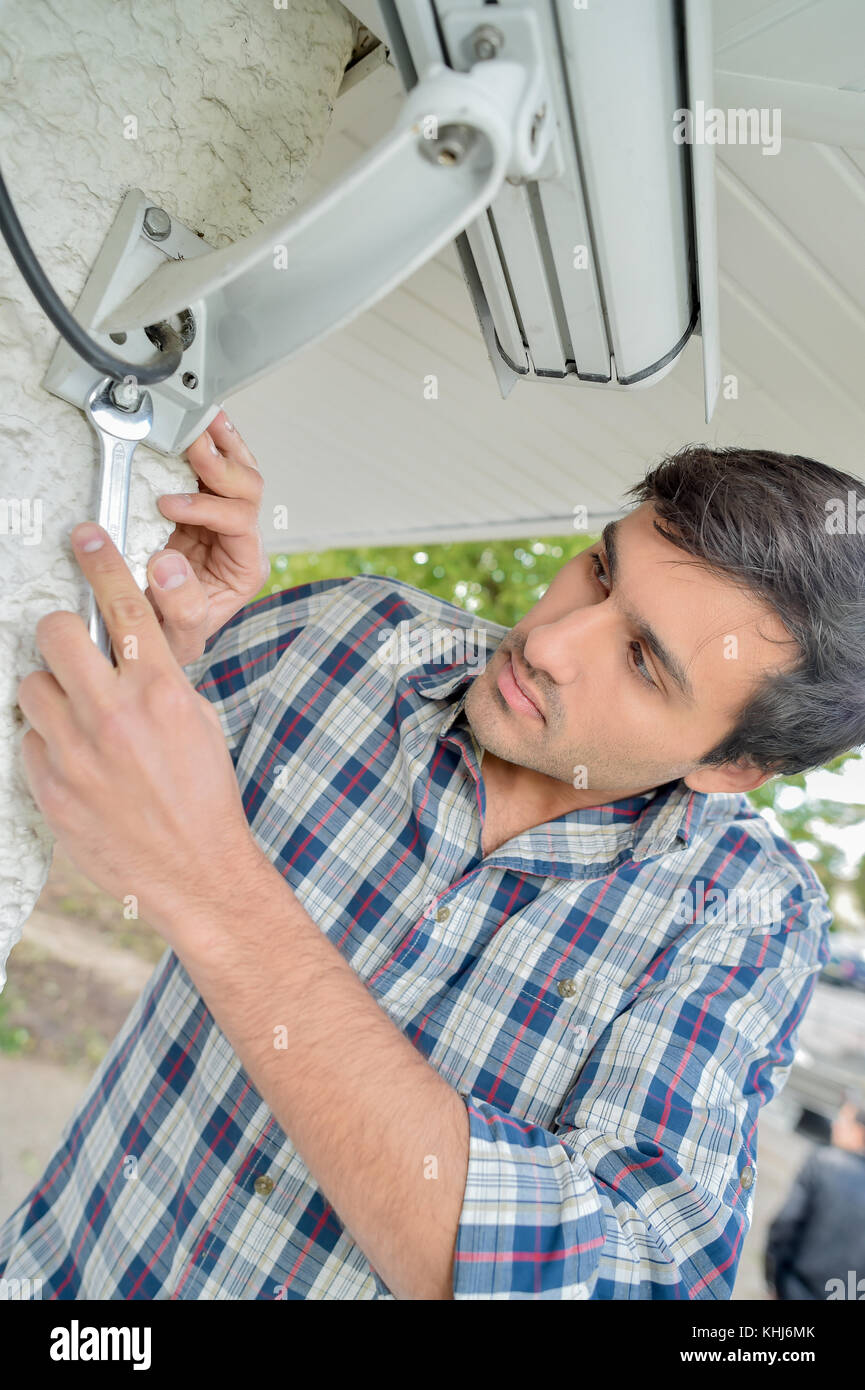 man installing video camera Stock Photo Alamy