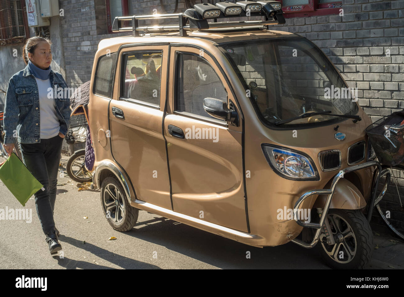 Unlicensed mini electric car is seen in Beijing, China. Stock Photo