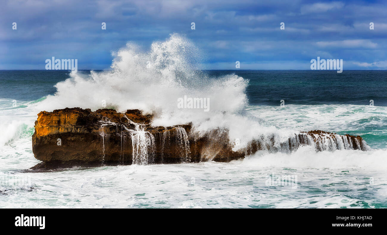 Stormy windy weather at Shipwreck coast near Peterborought town on Great Ocean roas southern coast of Victoria, Australia. Stron wave hits and rolls o Stock Photo