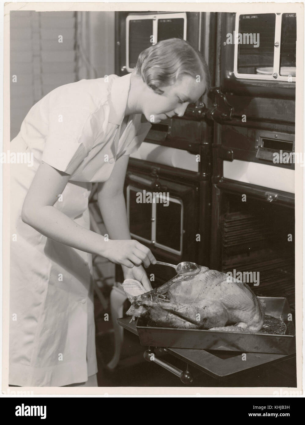Woman basting turkey hi-res stock photography and images - Alamy