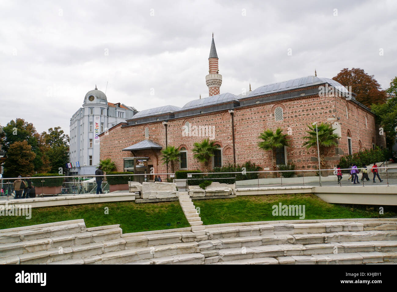 The Roman theatre of Plovdiv. The mosque in the background Stock Photo