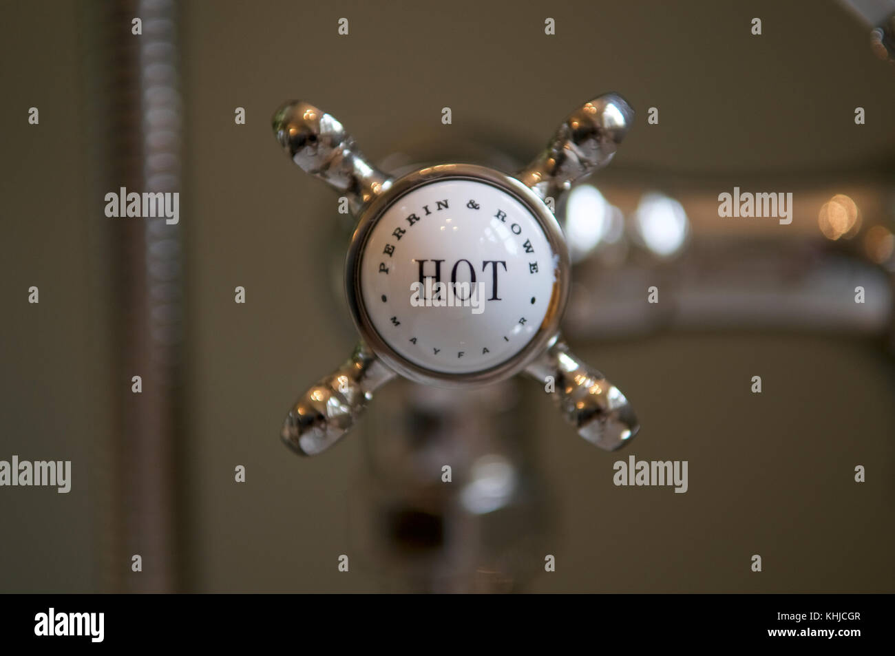 The hot tap of an old ceramic and chrome Perrin and Rowe Mayfair