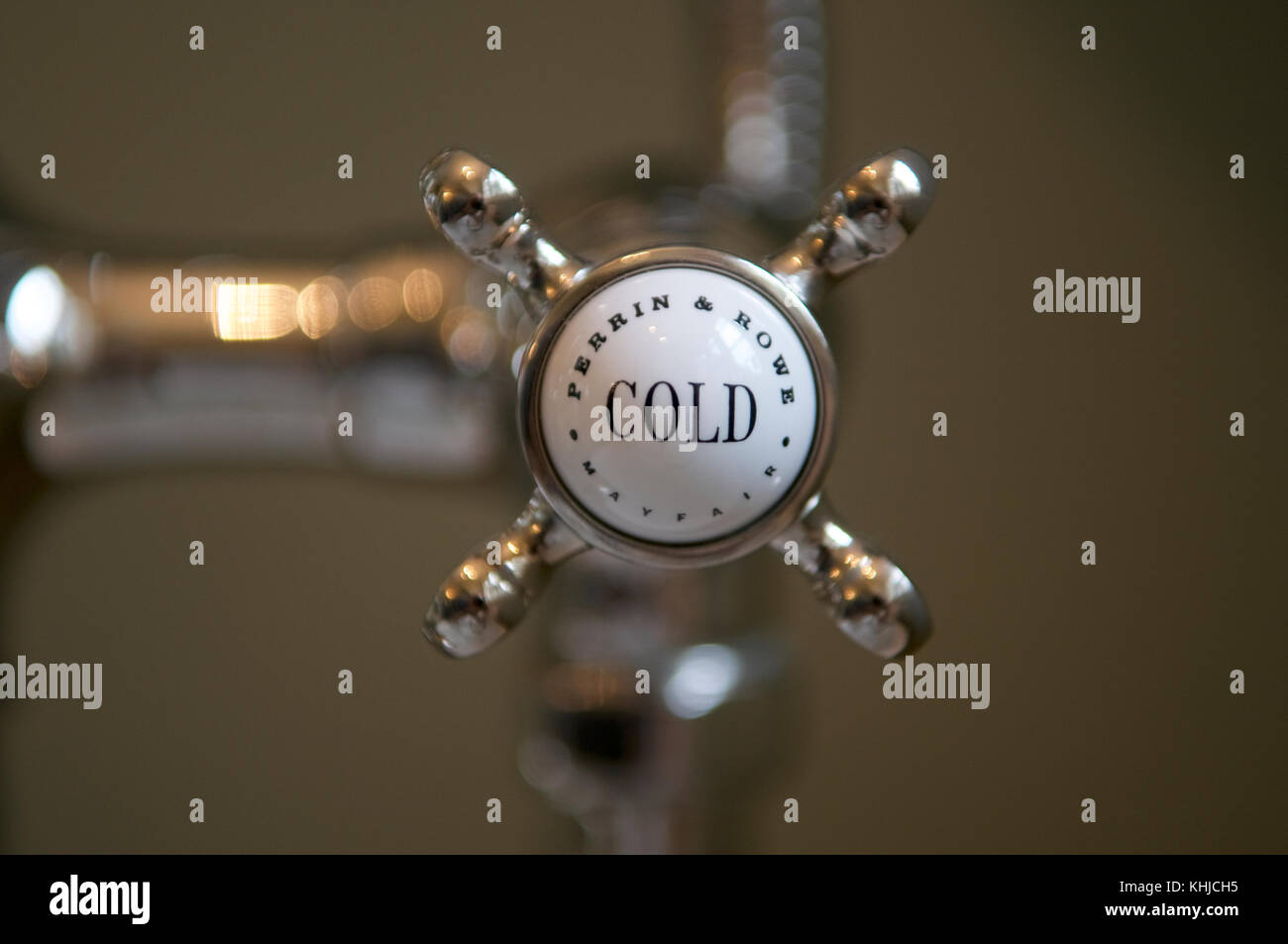 The cold tap of an old ceramic and chrome Perrin and Rowe Mayfair