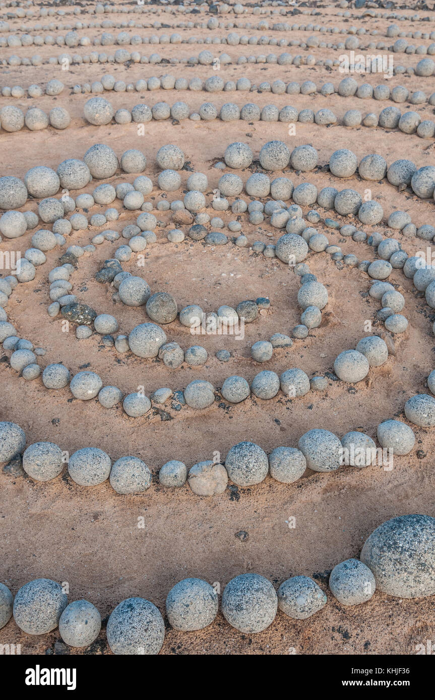 completely circular stones on the ground forming a spiral near the beach, Caleta del Sebo, La Graciosa, Canary Islands, Spain Stock Photo