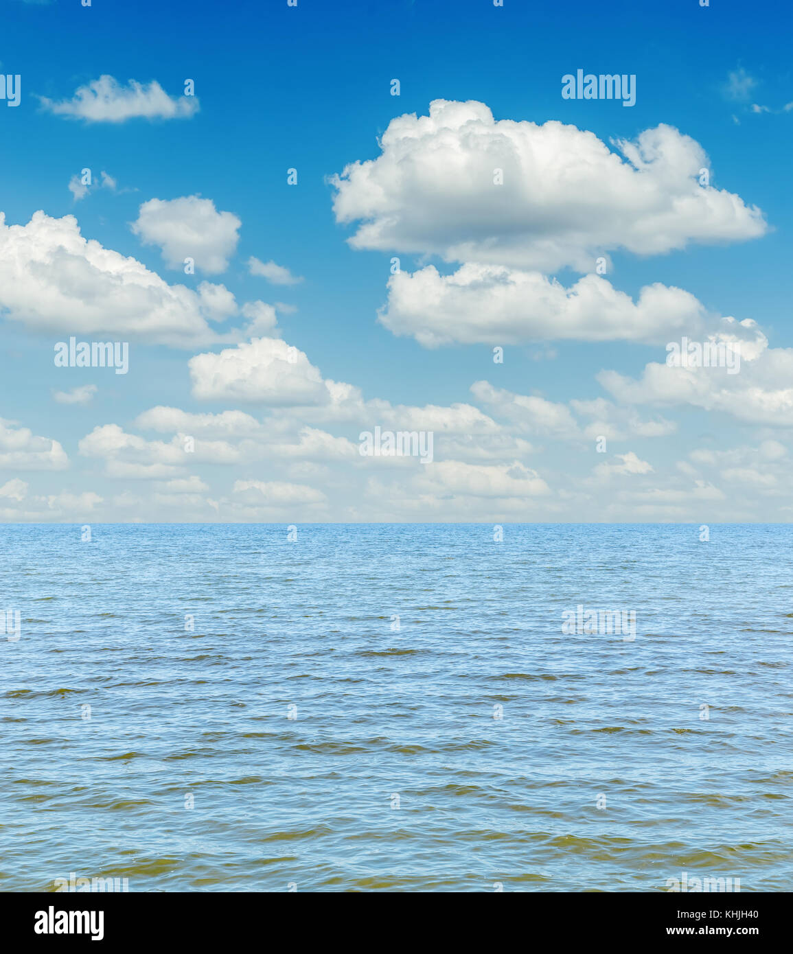 white clouds in sky over blue sea Stock Photo - Alamy