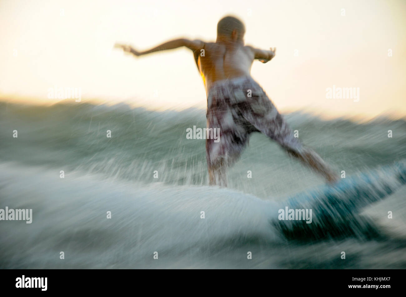 Israel, Mediterranean sea, Wave surfer as photographed from within the water. Model Release Available Stock Photo