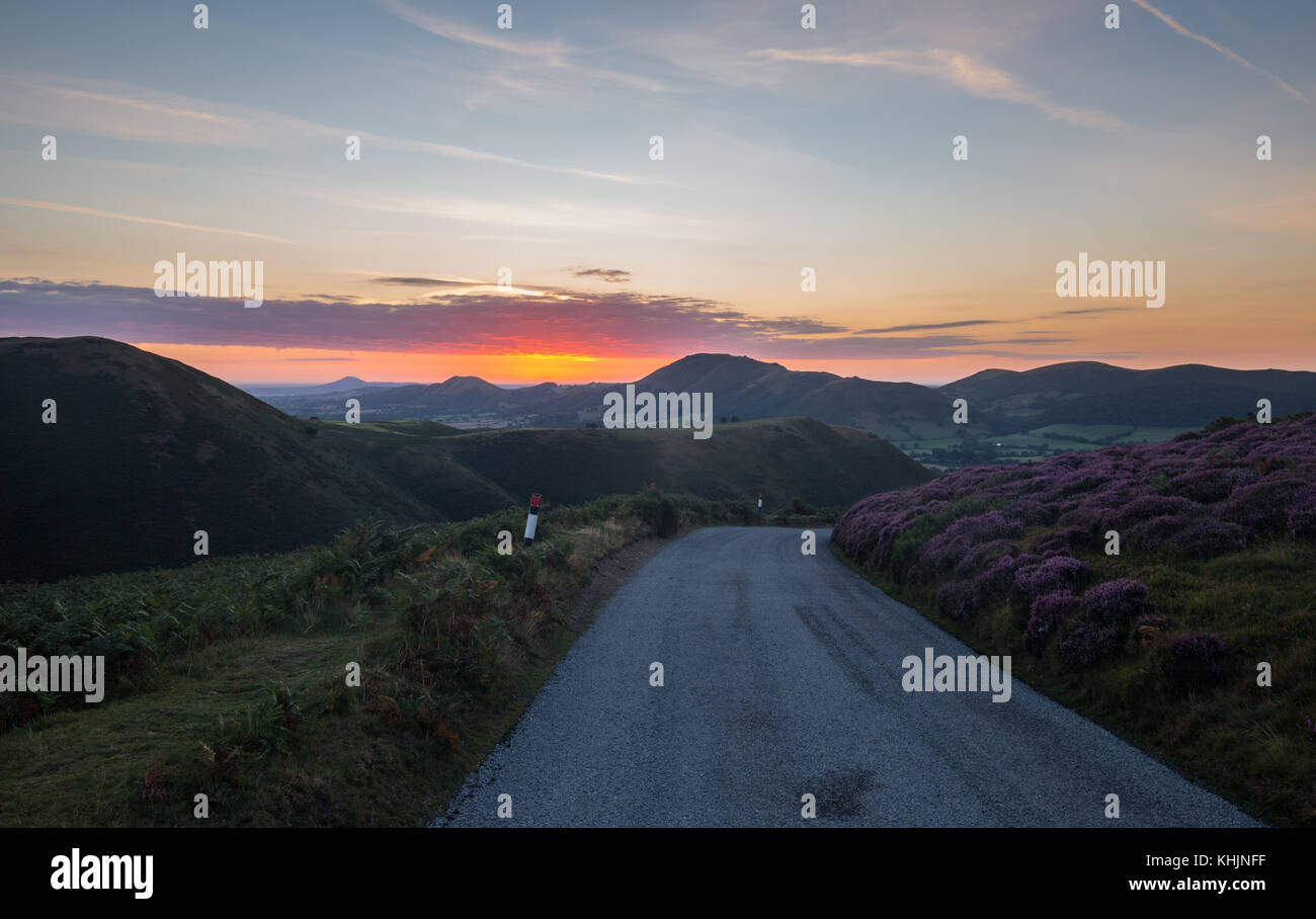 Empty Asphalt Road on the Top of Mountain at Sunrise Stock Photo