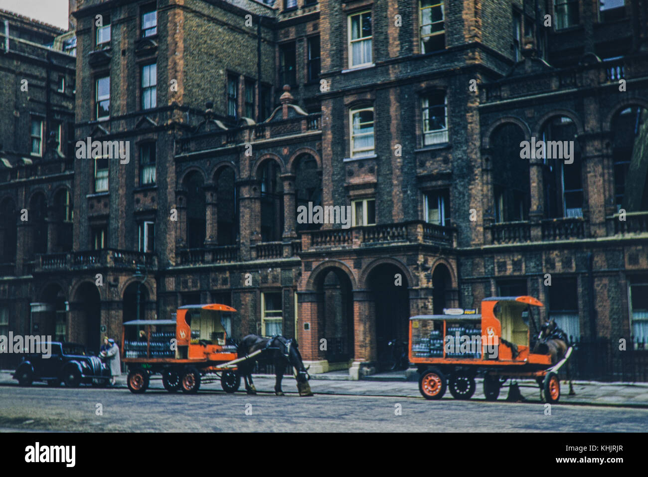 Horse drawn milk delivery at Bolton House, London on 15/07/56. Please note that due to the age of the image, imperfections might be visible. Stock Photo