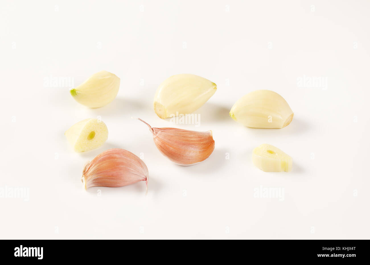cloves of fresh garlic on white background Stock Photo - Alamy
