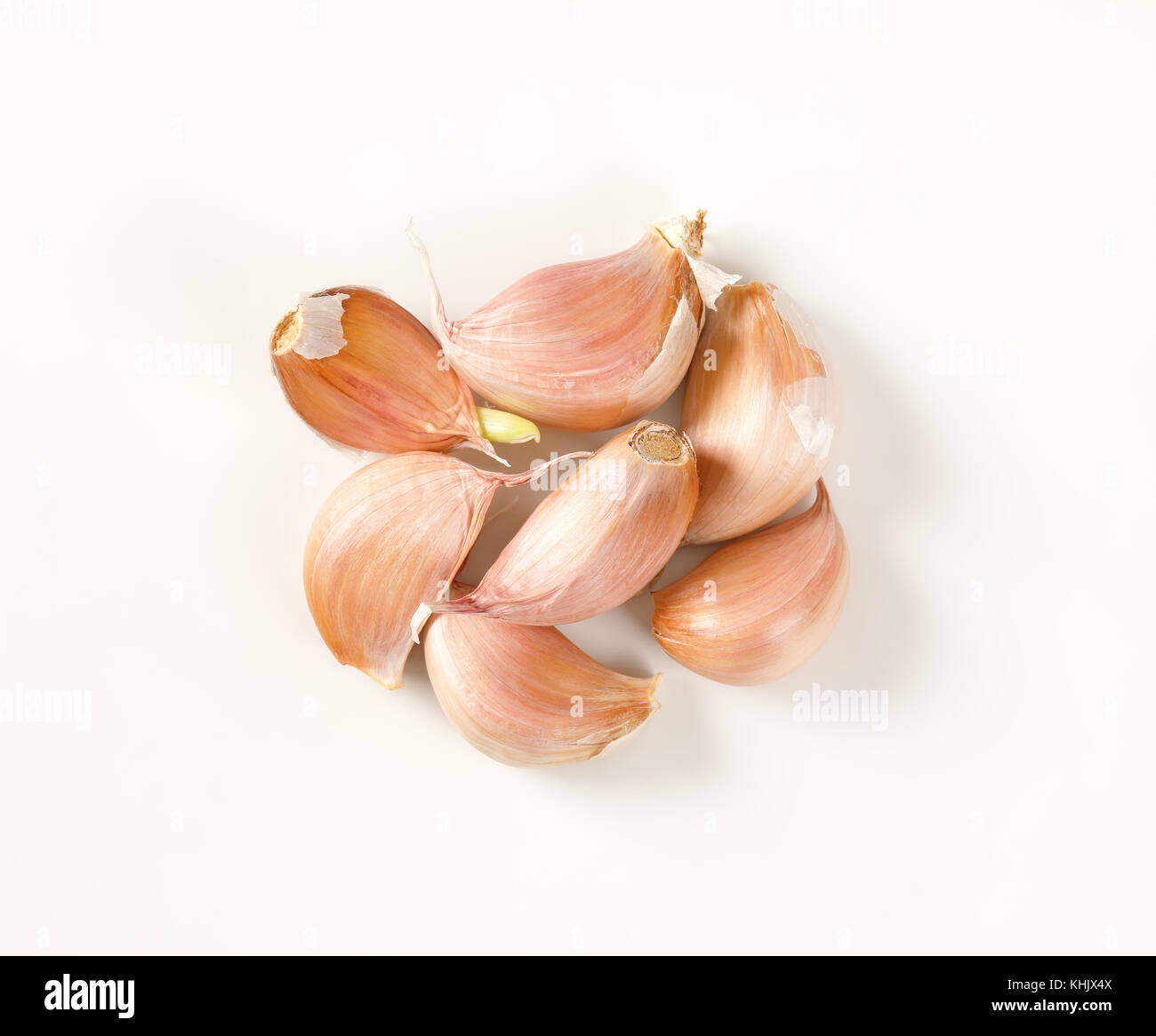 cloves of fresh garlic on white background Stock Photo - Alamy