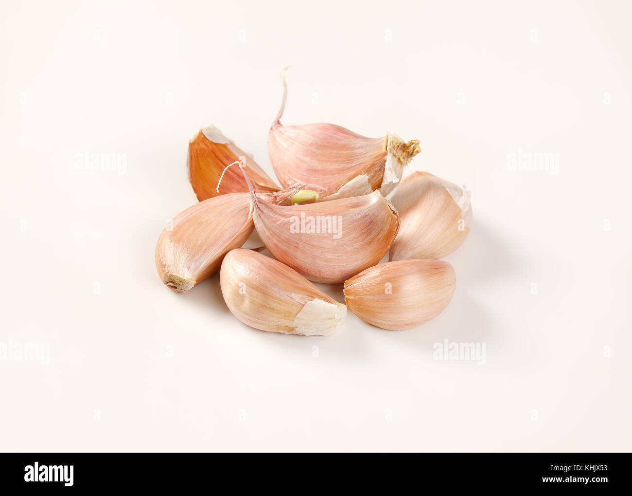 cloves of fresh garlic on white background Stock Photo - Alamy
