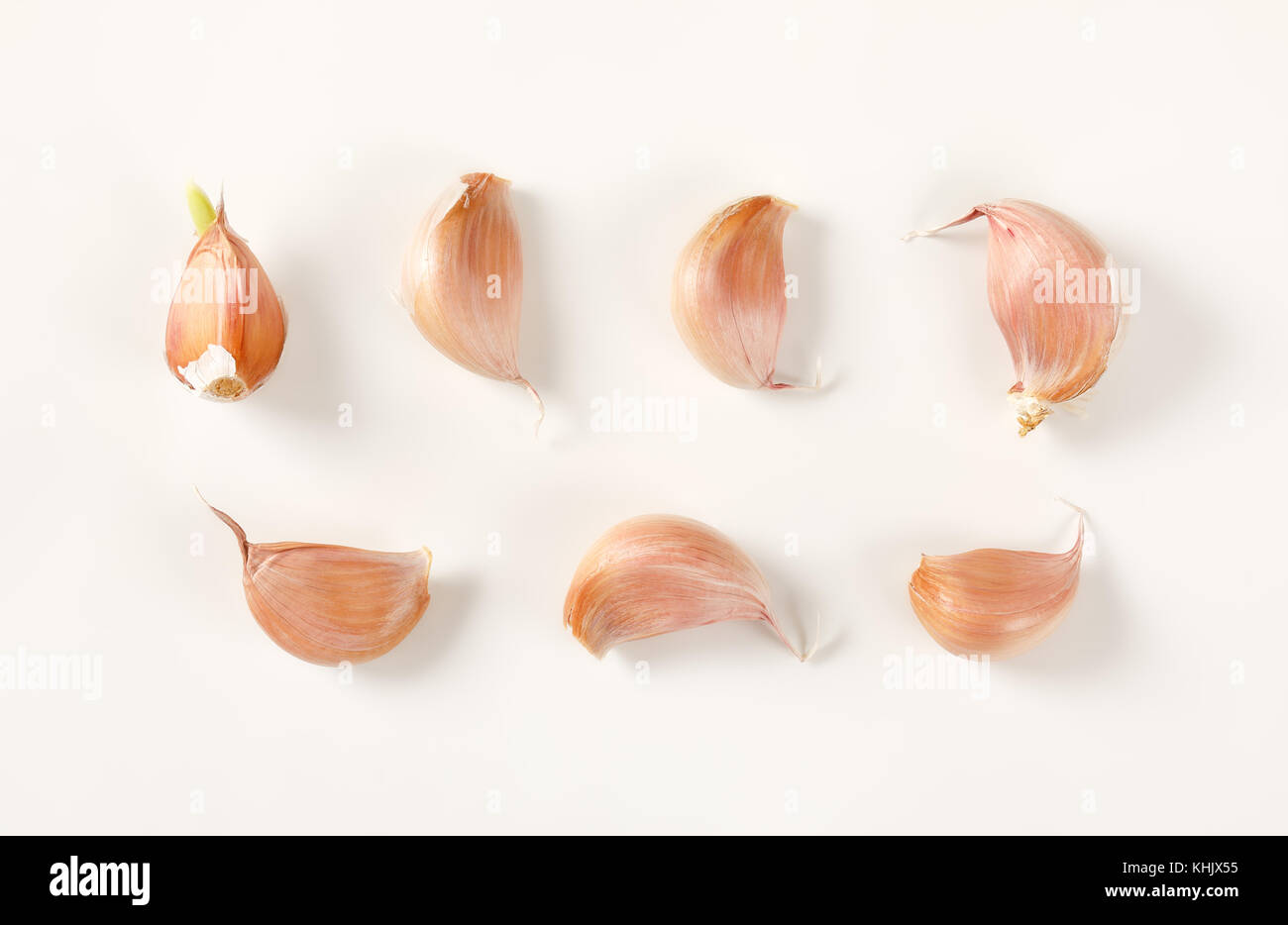 cloves of fresh garlic on white background Stock Photo - Alamy