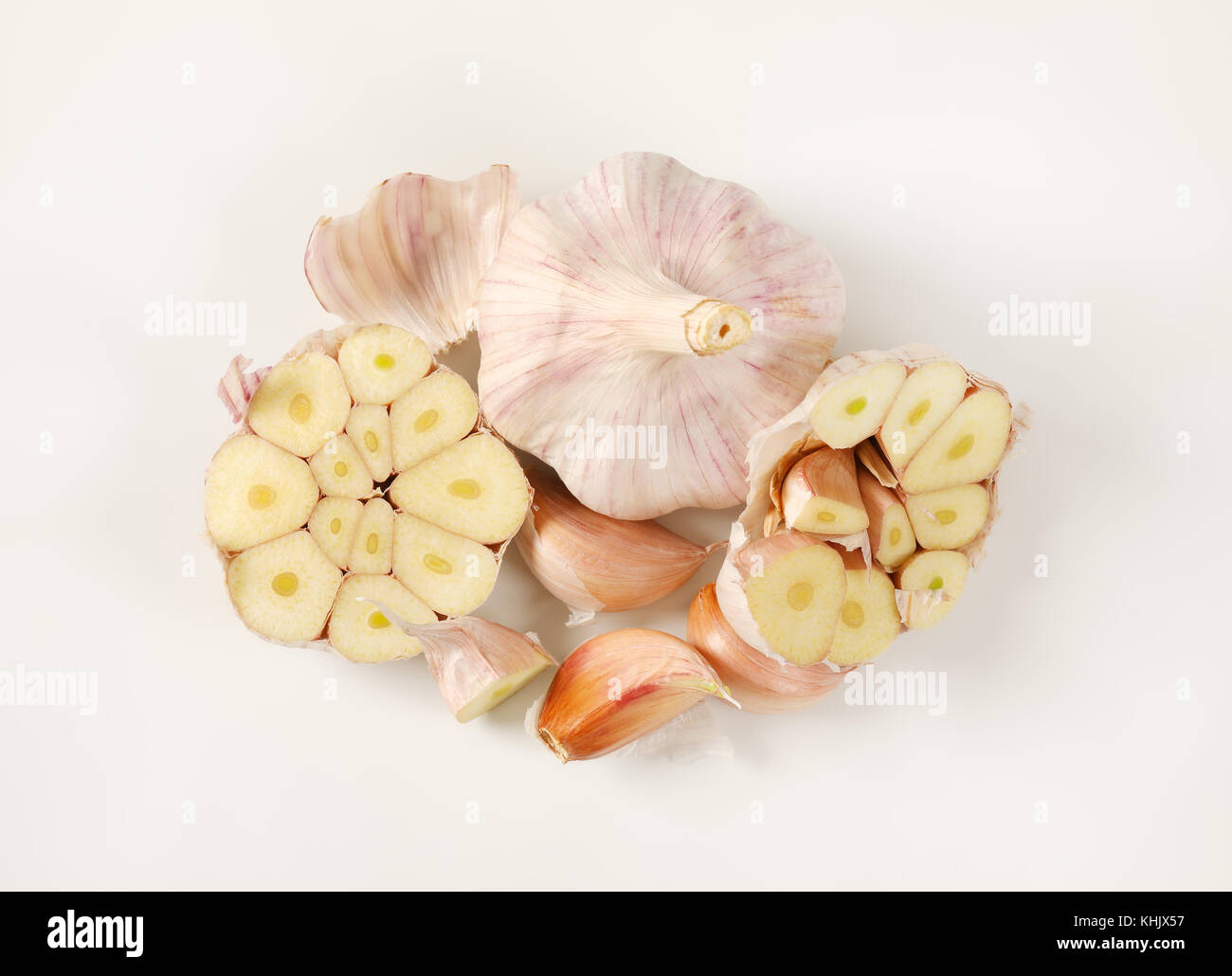 bulbs and cloves of fresh garlic on white background Stock Photo - Alamy