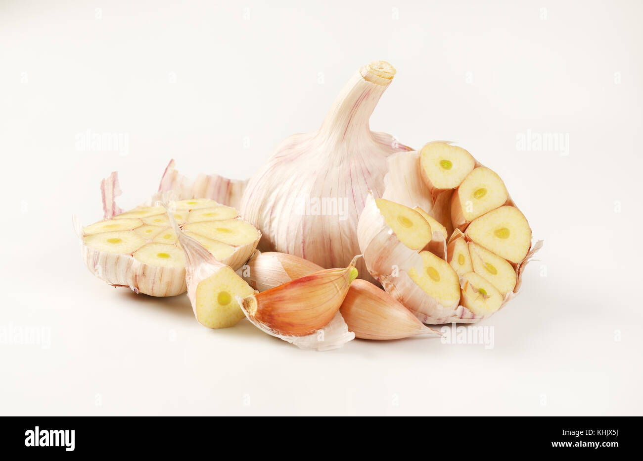 bulbs and cloves of fresh garlic on white background Stock Photo - Alamy