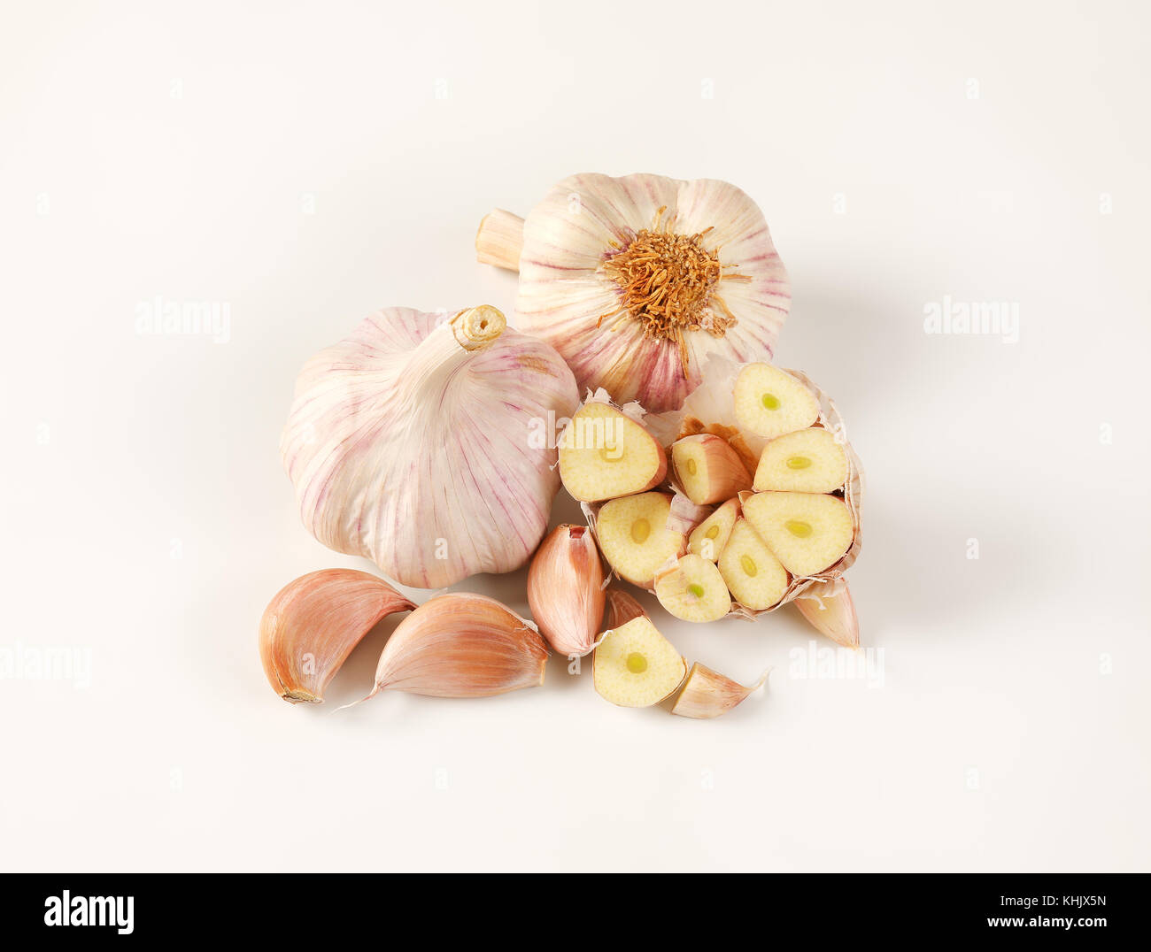 bulbs and cloves of fresh garlic on white background Stock Photo - Alamy