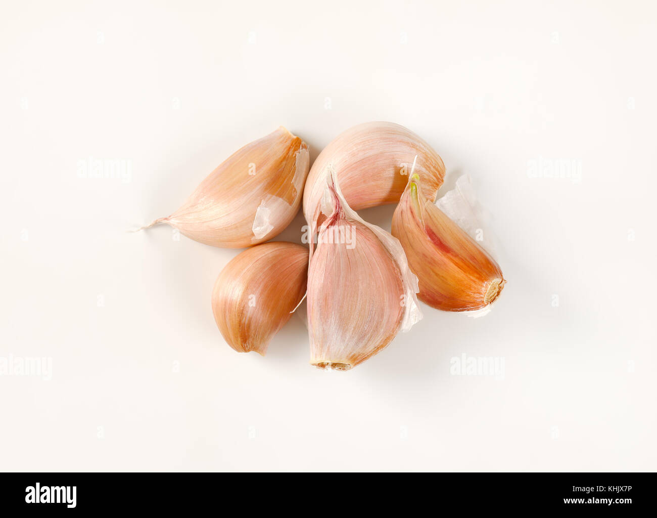 cloves of fresh garlic on white background Stock Photo - Alamy