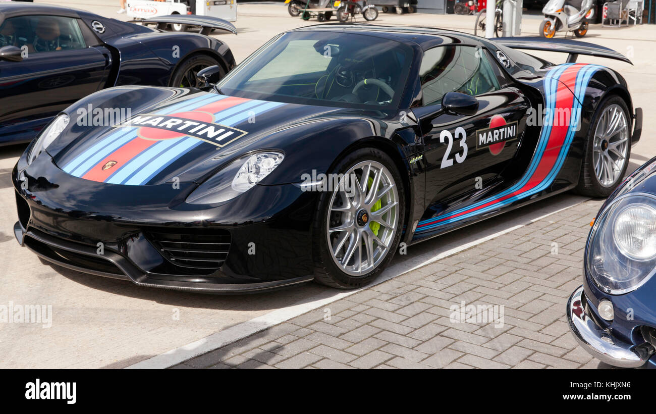 Three-quarter front view of a Porsche 918 Spyder hybrid supercar on display in the International Paddock at the 2017 Silverstone Classic Stock Photo