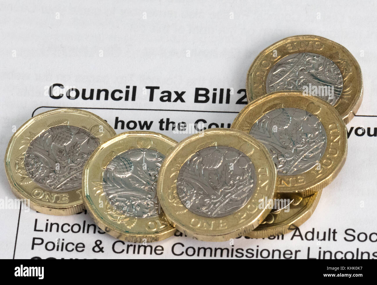New pound coins on a council tax bill Stock Photo