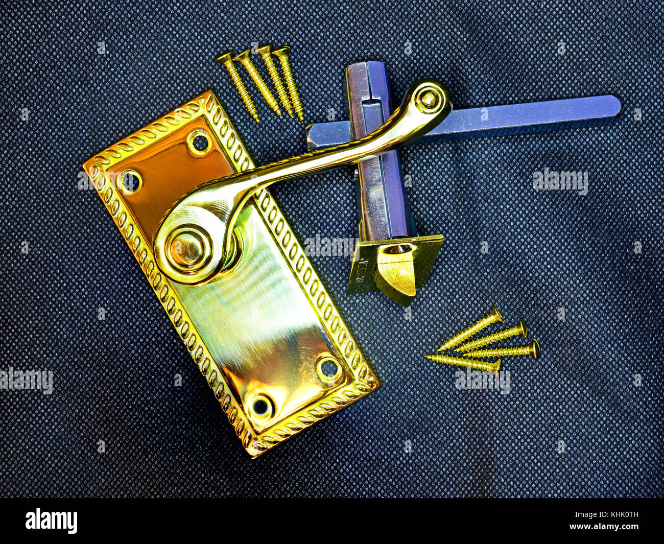 Brass door handle and screws with focus stacking top to bottom Stock