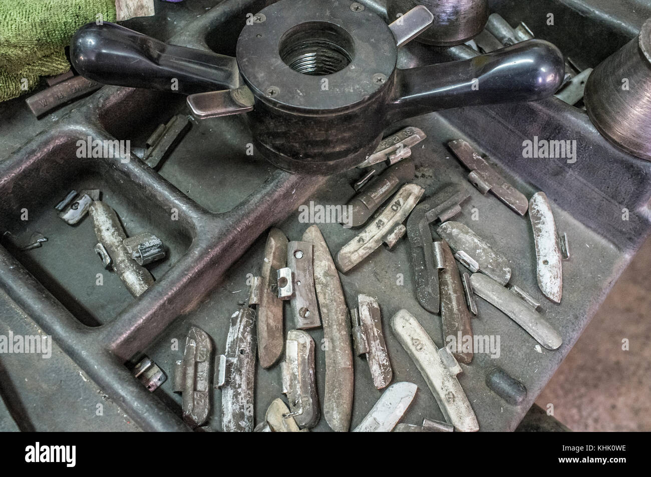 Lead small weights and tools for Wheel Balancing. Closeup Stock Photo