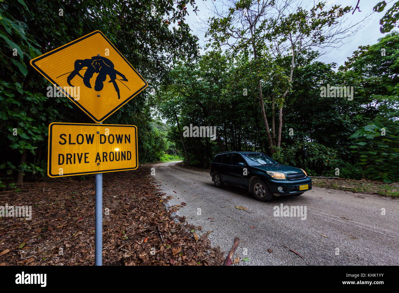 Driver Warning Sign on Road Side, Christmas Island, Australia Stock Photo