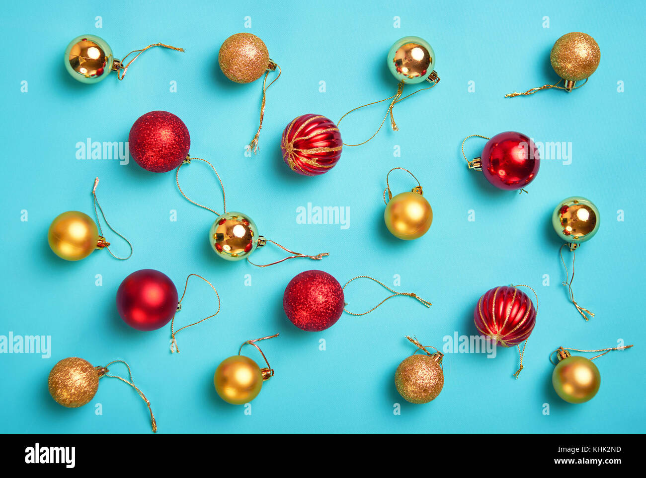 Pattern with christmas gold and red balls on a azure background ...