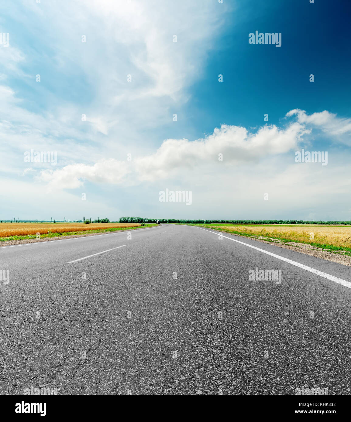 black asphalt road and clouds in dramatic sky Stock Photo - Alamy