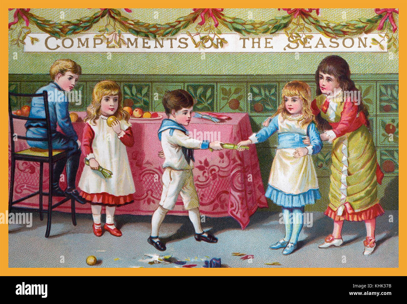 CHRISTMAS CRACKERS -A Victorian English postcard showing children pulling the recently invented  Christmas cracker Stock Photo
