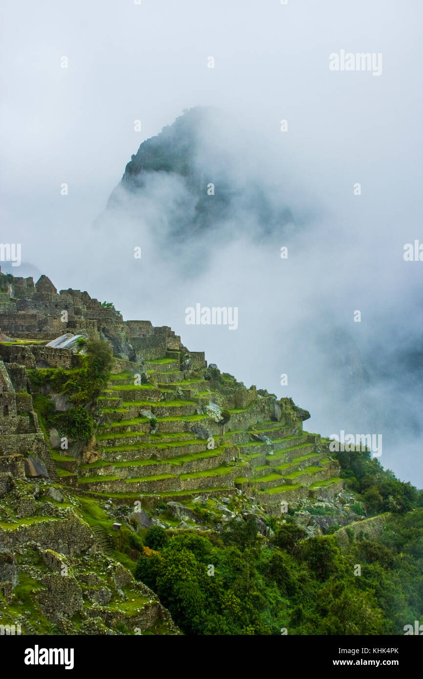 Machu Picchu, Peru, storm clouds and mist. Ancient Inca ruins. Stock Photo