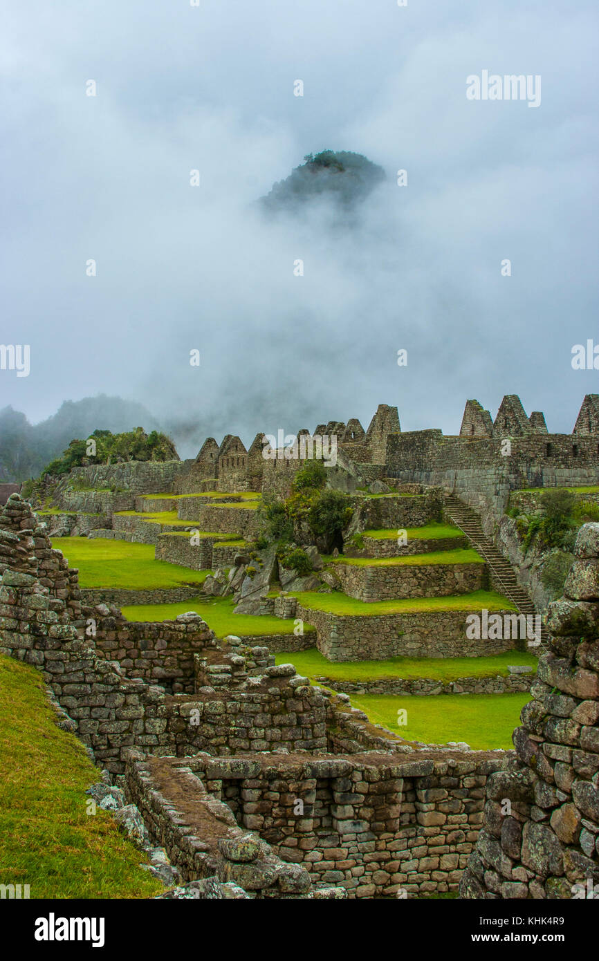 Machu Picchu, Peru, storm clouds and mist. Ancient Inca ruins. Stock Photo