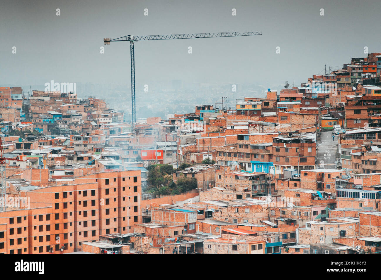 Looking out over the terracotta houses on the hillside suburb of Las Colinas, a neighbourhood in Bogotá, Colombia Stock Photo