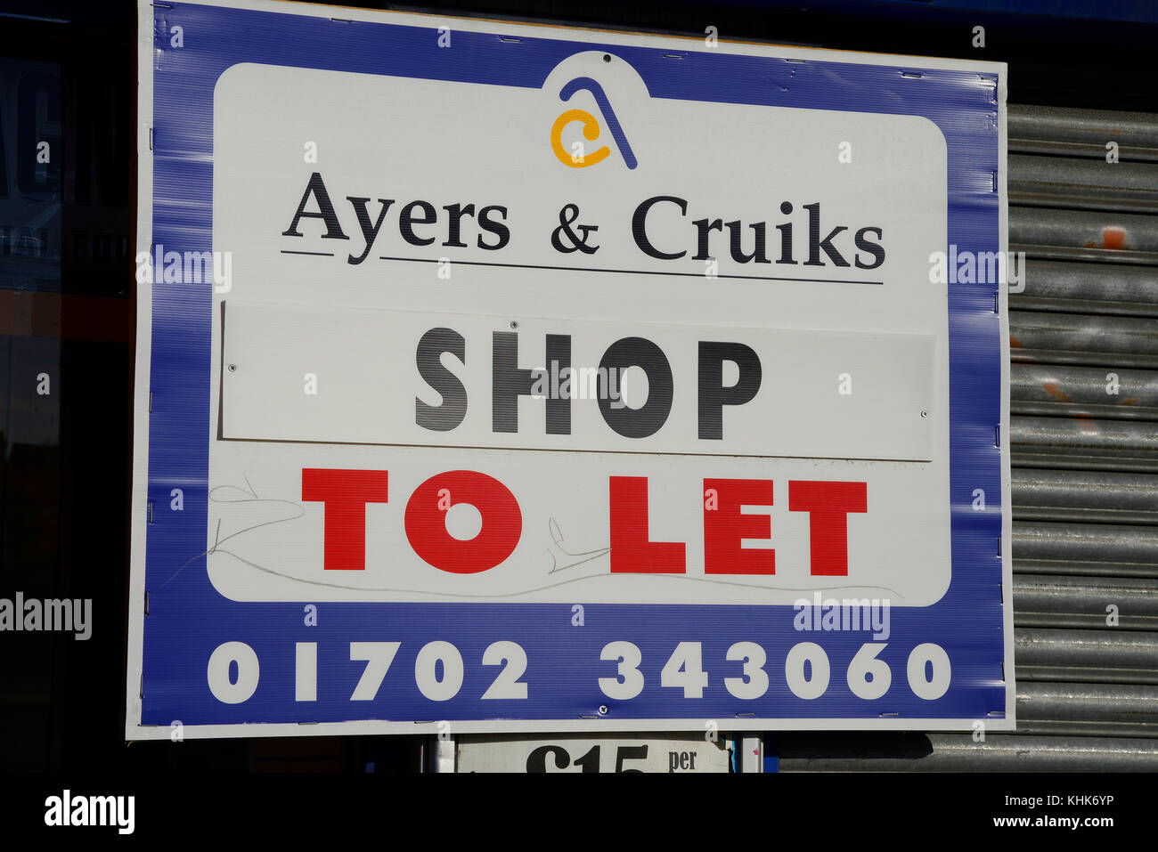 Ayers & Cruiks Shop to let sign. Commercial property. Shop shutter