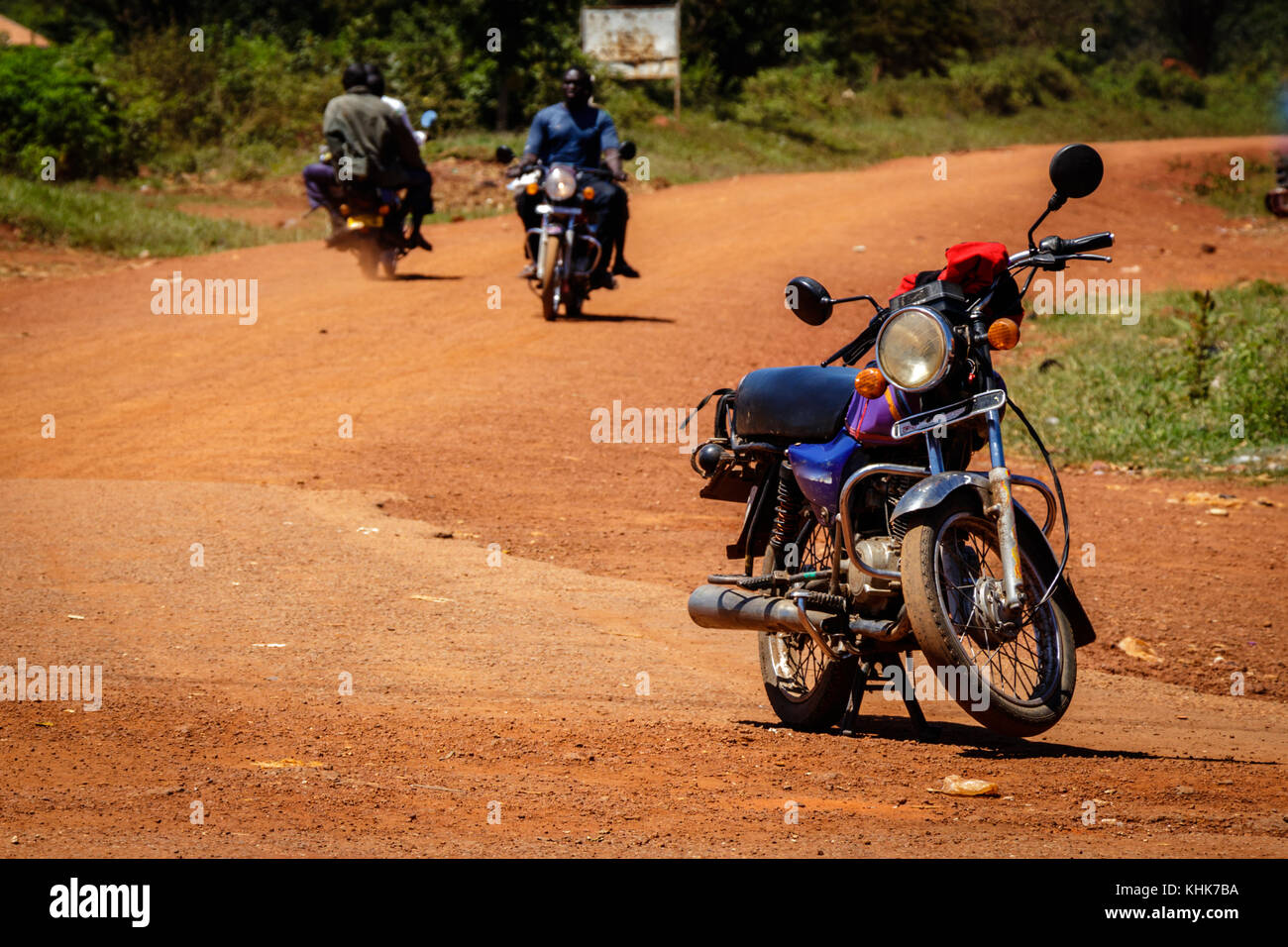 Boda boda are bicycle & motorcycle taxis commonly found in East Africa. These Boda Boda are waiting for customers Stock Photo