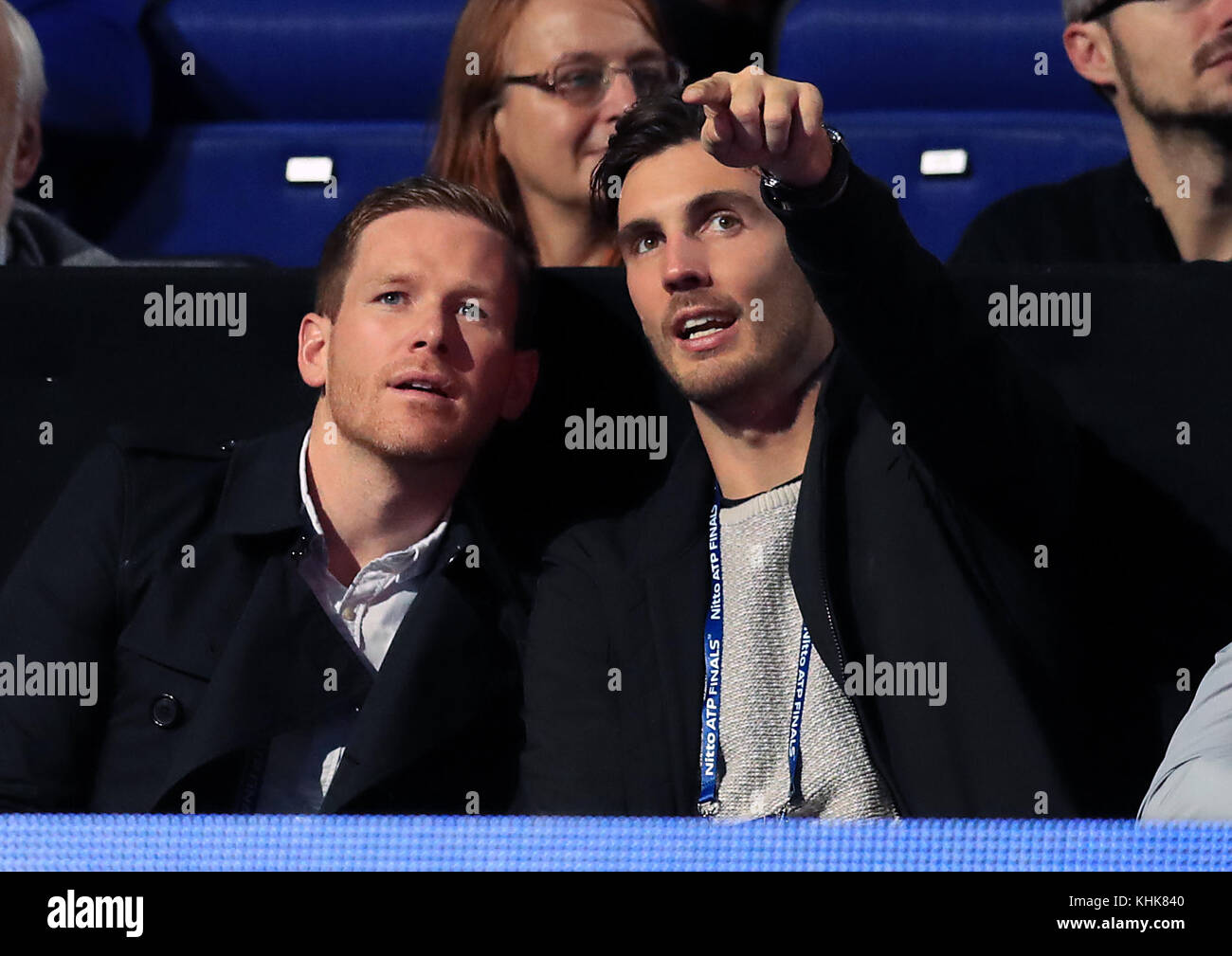 England Cricketers Eoin Morgan (left) and Steven Finn in the crowd during day six of the NITTO ATP World Tour Finals at the O2 Arena, London. Stock Photo